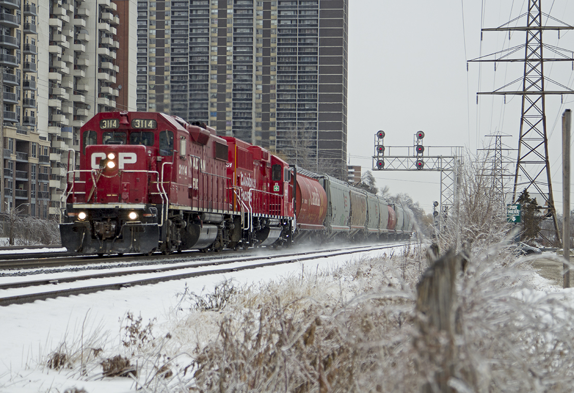 A winter wonderland CP T14 with CP 3114, CP 2251 with 9 cars in tow dash through the snow headed for Streetsville.