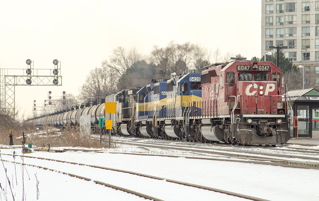 CP 6047, ICE 6427, DME 6051 and CSXT 533 this 348 axle train dashes thru the snow making it's way east.