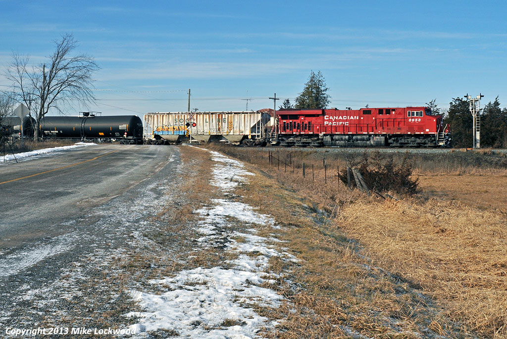 CP leads train 608 passes the approach signal to Roblindale Siding. Yes, that is my camcorder and tripod in frame on the left. 1128hrs.