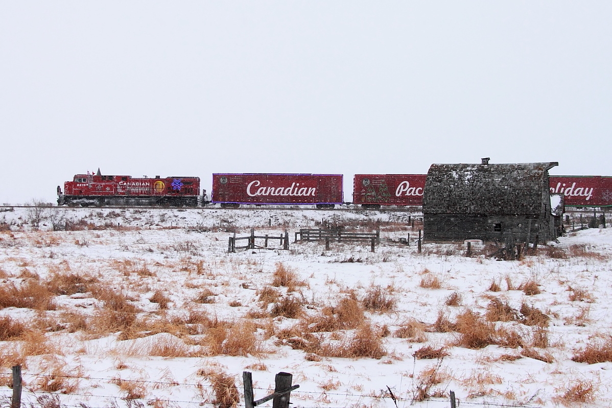 CP's Holiday Train rolls by the old barn at Esmond.