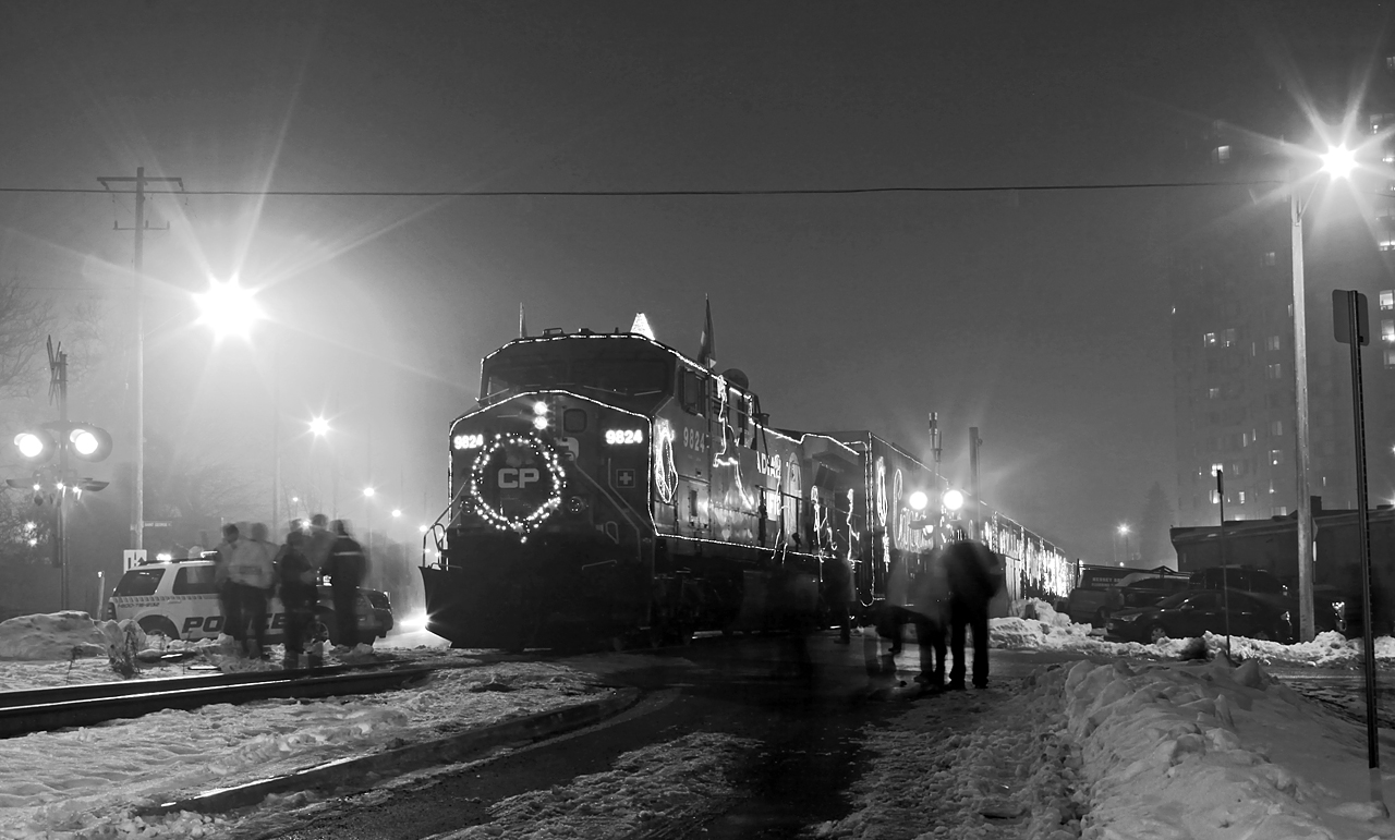 CP's Holiday train makes its' annual London stop on a rather foggy night at the St. George street crossing. The fog and the sodium street lights made for a very yellow-cast scene so I thought I'd try a B&W edit on this one.