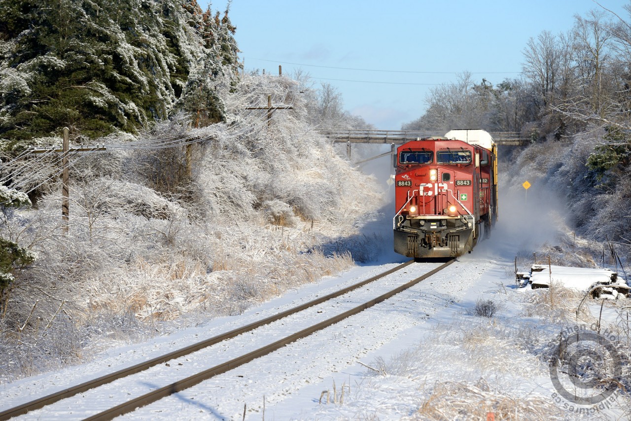 Merry Christmas everyone! A pair of GEVOs muscle their train past an old wooden farm bridge - while everything is coated in ice and snow due to the recent storm.