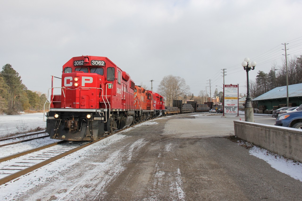 CP 3062 leads CP 8248 and CP 2255 north towards the Toyota plant in Cambridge, Ontario. Note that the 8248 and 2255 are the old and the new in terms of locomotive power on recent trains on CP (in this case, the CP Waterloo Sub). CP 8248 looks derelict against the new GP20C-ECO 2255. This location was on my bucket list for quite some time. Today, I  finally had the opportunity to shoot this train here: Eagle Street North and the CP Waterloo Sub, Cambridge (formerly Preston), Ontario. Time: 11:28.