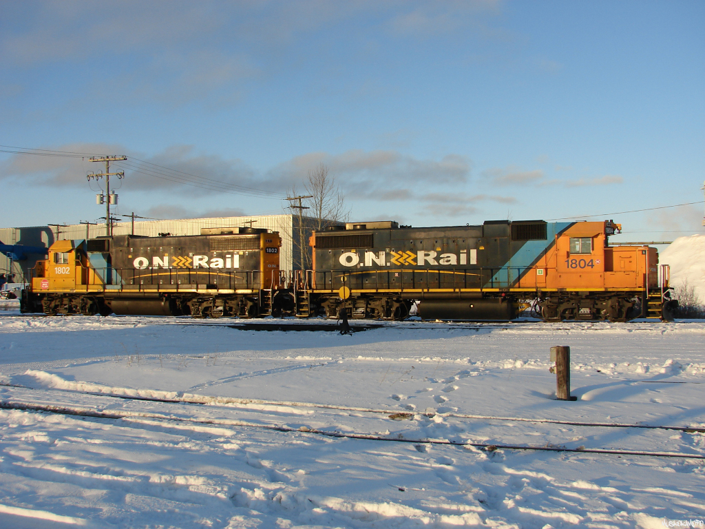 ONT 1804 and ONT 1802 soak up some evening sun in Hearst. Note that both are decked out in "Not For Sale" stickers!