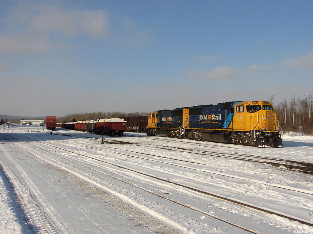 ONT 2102 and 2104 sit in North Yard 5 @ Englehart waiting for their crew to hop on shortly and head to the North end of the yard to grab their train 211-11 for Noranda, PQ.