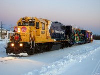 ONT 1809 North with 999, also known as the Christmas train, slowly ambles their way through Moonbeam at last light en-route to a show and stay in Kapuskasing for the night, before continuing onto Hearst the next morning during the 2013 Christmas train tour! 