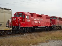 CP 7307 after receiving a fresh rebuild and repaint at NRE in Silvis IL, trails on an eastbound CP freight thru Tilbury.