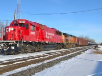 A welcome sight becoming more common lately. CP 609 with CP 6257 & BNSF 4442, waits in the siding at Belle River for a couple eastbounds to pass by.