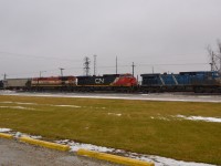 Providing a little variety of colour on an otherwise gloomy rainy day, CP 641 led by CEFX 1052-CN 2597-BCOL 4622 heads westbound towards Windsor as it passes thru Tilbury.