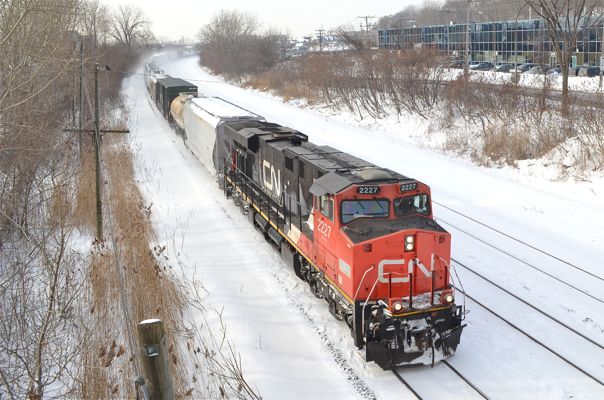CN 2227 heads east with CN 324, bound for St-Albans, Vermont. For more train photos, check out http://www.flickr.com/photos/mtlwestrailfan/