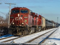 CP 8500 & CP 8755 lead an empty unit train westwards through Beaconsfield and are about to cross over Woodland Avenue. For more train photos, check out http://www.flickr.com/photos/mtlwestrailfan/ 