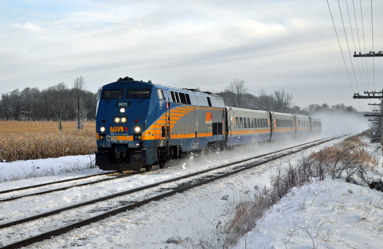 On a crisp -20 November morning, Via 641 makes its way west to Toronto at 90 MPH. Kicking up the first big snow of the season as she goes.