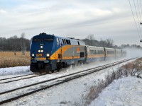 On a crisp -20 November morning, Via 641 makes its way west to Toronto at 90 MPH. Kicking up the first big snow of the season as she goes. 