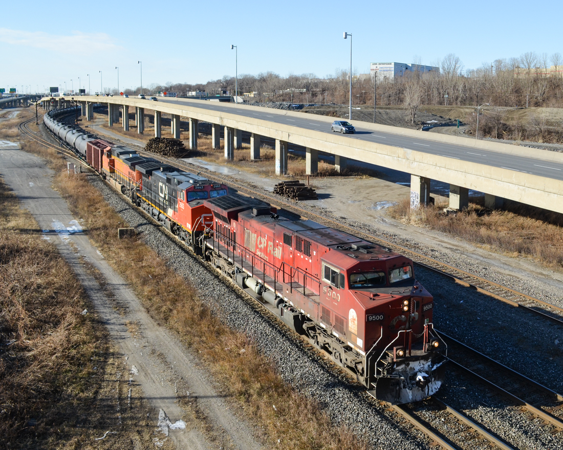 Three Class 1's represented CP 9500, CN 2663 and BNSF 4157 is the wild lashup on CN 710 (loaded oil train) which is seen heading east after changing crews at Turcot West. For more train photos, check out http://www.flickr.com/photos/mtlwestrailfan/