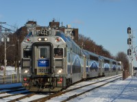 Cab car AMT 3011 is leading AMT 15 westbound through the crossovers at Montreal West on a sunny and cold day. Pushing on the rear is AMT 1321 (GMD F59PHI. For more train photos, check out http://www.flickr.com/photos/mtlwestrailfan/ 