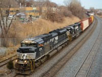 NS 2714 & NS 6632 head west through Montreal West as the conductor gives a friendly wave. This was a nice surprise as the train (CN 529) usually operates in the middle of the night. CN 529 runs Rouses Point-Taschereau Yard with a Canadian CN crew. The train originates in Harrisburg, PA. For more train photos, check out http://www.flickr.com/photos/mtlwestrailfan/ 