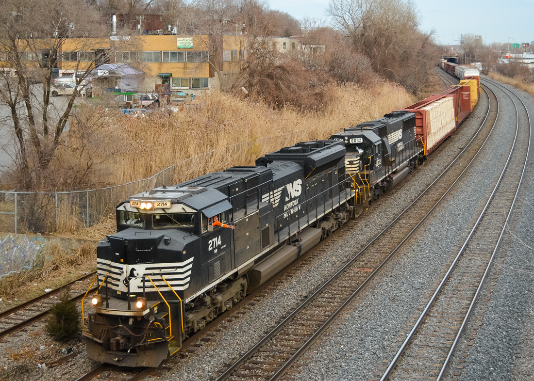 NS 2714 & NS 6632 head west through Montreal West as the conductor gives a friendly wave. This was a nice surprise as the train (CN 529) usually operates in the middle of the night. CN 529 runs Rouses Point-Taschereau Yard with a Canadian CN crew. The train originates in Harrisburg, PA. For more train photos, check out http://www.flickr.com/photos/mtlwestrailfan/