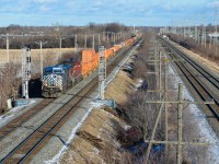 At the very western tip of the island of Montreal we see CEFX 1048 & CP 9729 heading west with a stack train and passing a new set of signals which have yet to be activated. To the right is CN's Kingston Sub. For more train photos, check out http://www.flickr.com/photos/mtlwestrailfan/ 