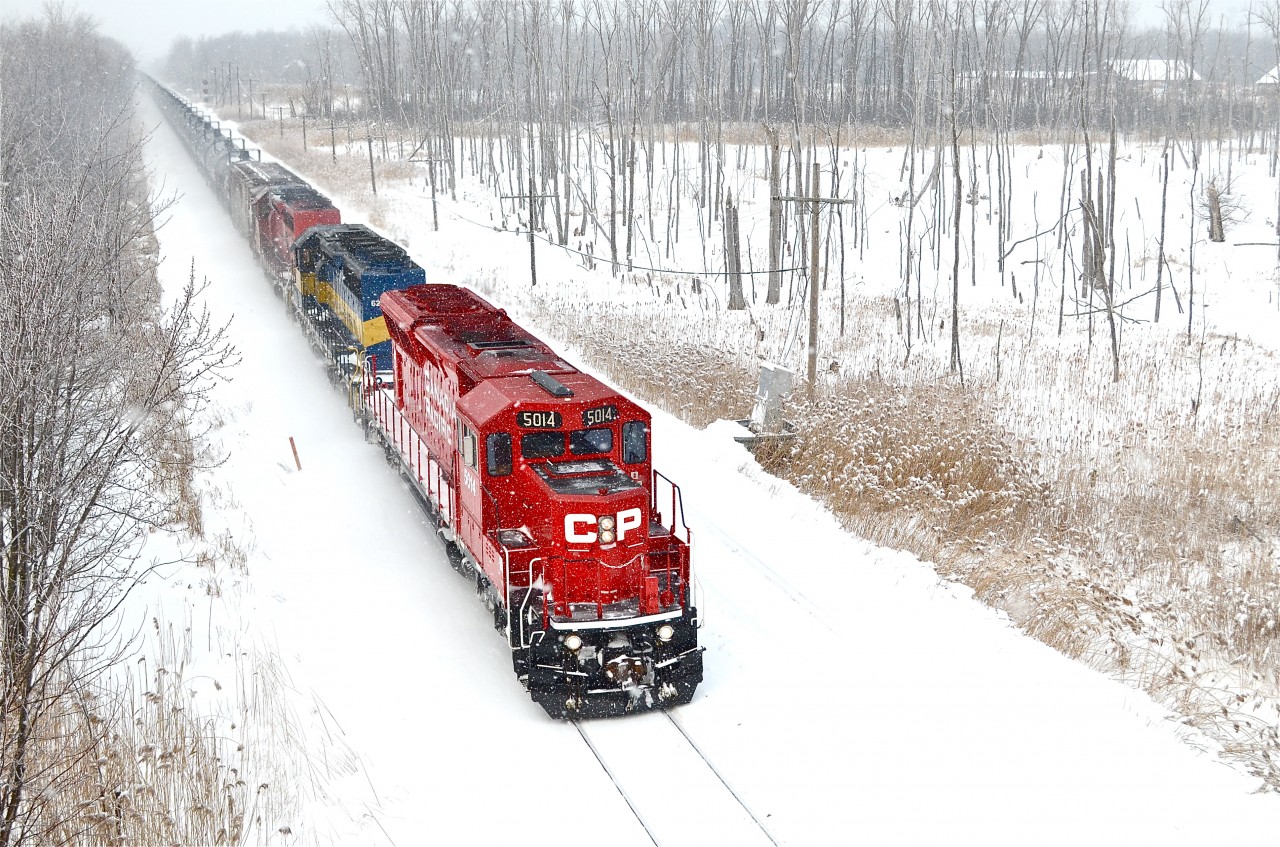 CP 5014, ICE 6212 and DME 6084 lead a loaded ethanol train (CP 642) east just a few minutes after leaving the island of Montreal. For more train photos, check out http://www.flickr.com/photos/mtlwestrailfan/