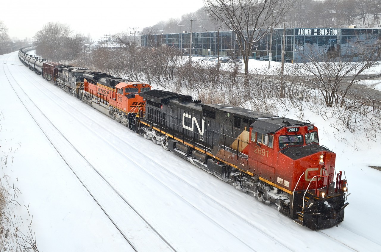 CN 2691, BNSF 9112 & NS 8449 are the power on a loaded oil train which is about to stop for a crew change at Turcot West. For more train photos, check out http://www.flickr.com/photos/mtlwestrailfan/