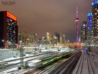 <B>Merry Christmas!</B> By a frosty evening, an outbound pass under Bathurst St. in front of Toronto city, and the CN Tower in background.