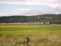 I love this landscape. Minus the hydro poles, it would be perfect. Flat fields, rolling up into low rocky peaks. The ballast train is approaching the village of Bar River; with all 20 cars and both locomotives stretched out in plain view. It's still another hour or so along 10mph track before the train can make it up to a "blistering" 25 mph. Hey, still better than 179 miles of 10mph, like it was only a couple years past.