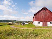 A different kind of "Red Barn!" The ballast train passes the Finnish homestead on the road into Bar River.