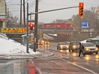 A former Havelock unit 3114 and new 2251 bound for Streetsville as T12 depart Toronto Yard,as commuters go about their business in Sheppard west village.