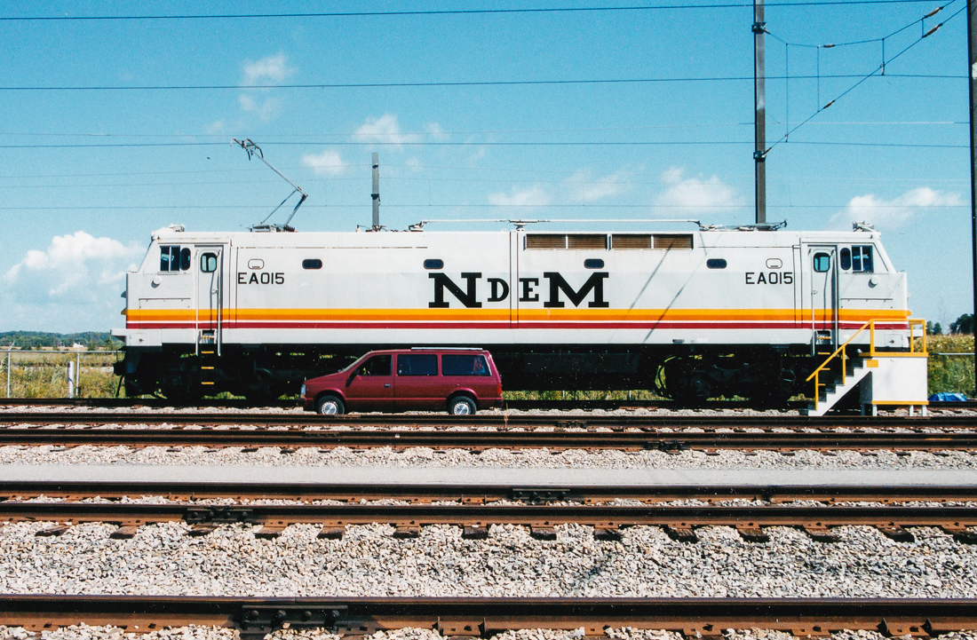 This photo was taken by my father-in-law (Glen Fisher) who was involved in attempting to sell/lease N de M electric locomotives to Montreal's AMT (commuter train agency) for use on the electrified Deux-Montagnes line. The AMT decide not to use them and all were scrapped in 2007. Here one is seen in the AMT's St-Eustache Yard at the end of the Deux-Montagnes line.