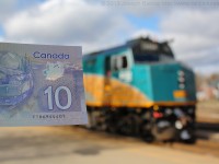 <B>Canada's New $10 Bill!</B> <br>In July it was announced that an image of the Via Canadian would be on the new ten dollar bill.  Via 6403 now graces one side of the new bill.  6403 has since been renumbered to 6459.  In November the new bills were released and I took this photo at Brantford with the new bill alongside Via 6452.
