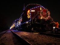 The Canadian Pacific Holiday Train sits at Kinnear Yard in Hamilton Ontario on a nice and cold night.  Most people have stopped walking around the train and the conductor is getting ready to get on and take the train back to Aberdeen yard for the night.