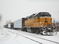 GEXR 581 with LLPX 2210 on the point is stopped in Kitchener briefly during one of the days many snow squalls.