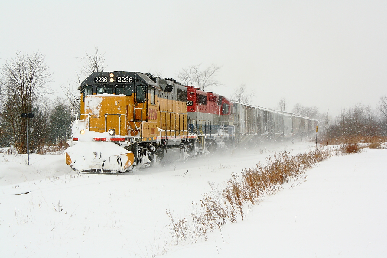GEXR 581 slowly makes its way towards the town of Mitchell with LLPX 2236 and RLK 4095 providing the power for the train.  They had been doing drift busting all the way from Goderich and encountered snow squalls also.