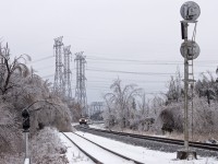 A brutal ice storm swept across most of Southern Ontario on the night of Dec 21st and continued into the morning of the 22nd. This caused mass havoc for most, including the railway, as there were hundreds of trees down and a large number of signals were inoperable. In this image, CP 113 has just cleared Cherrywood after a stressful trip from Smiths Falls this morning. Formen have now received their TOP's and will begin trimming and removing vulnerable debris which could add even more delays to operations.