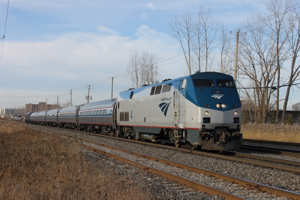 Amtrak loco 4 on rte68 to New York pulling a private car Tioga Pass Baristow California the car was built in 1959 by Canadian National in Pte St-Charles Mtl number 23 and have served in Albertafor the president of Mountain Régions now belong to LA Rail
