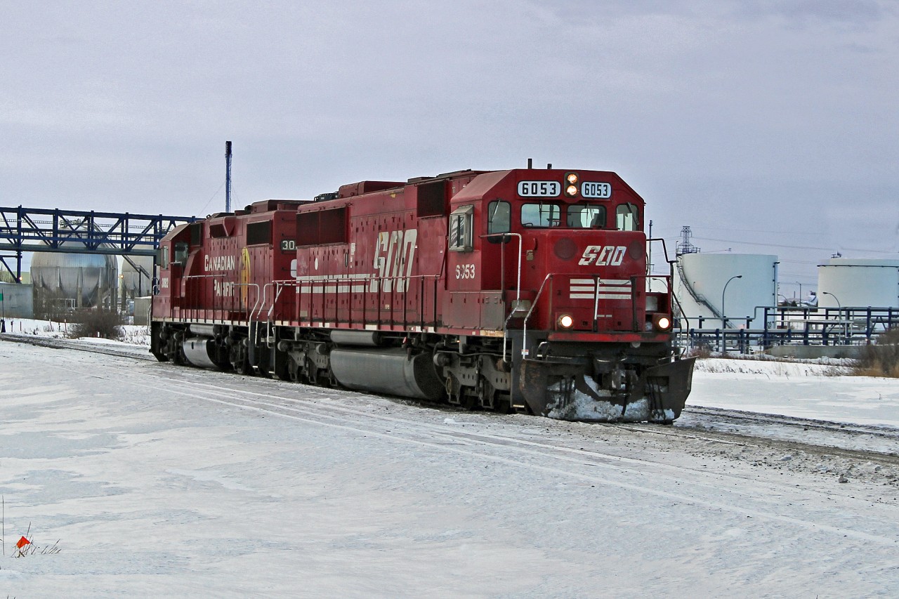 Ex SOO SD60 6053 and SD38-2 CP 3082 approach CP's Clover Bar yard on the Scotford Sub