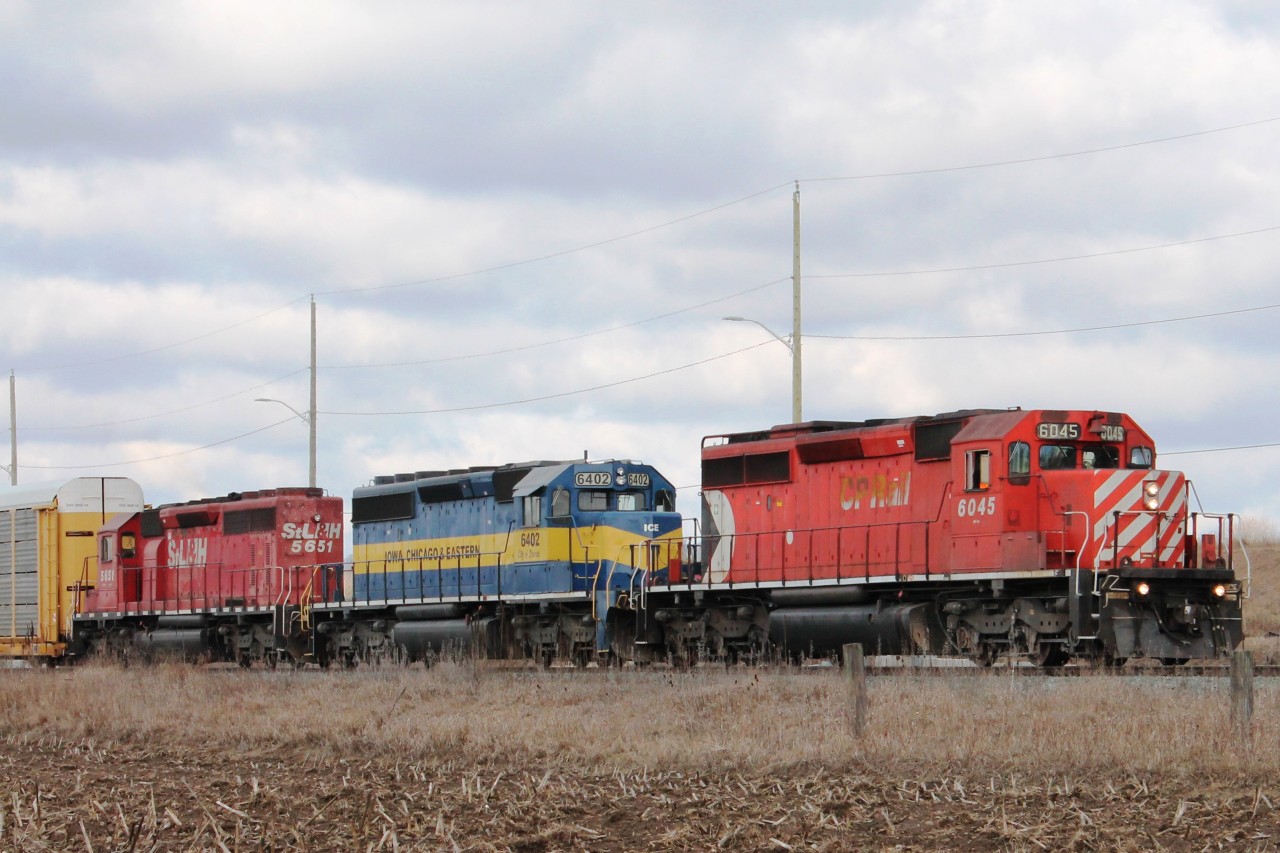 An eastbound autorack leaves the east end of Wolverton yard on an overcast April day!