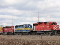 An eastbound autorack leaves the east end of Wolverton yard on an overcast April day!