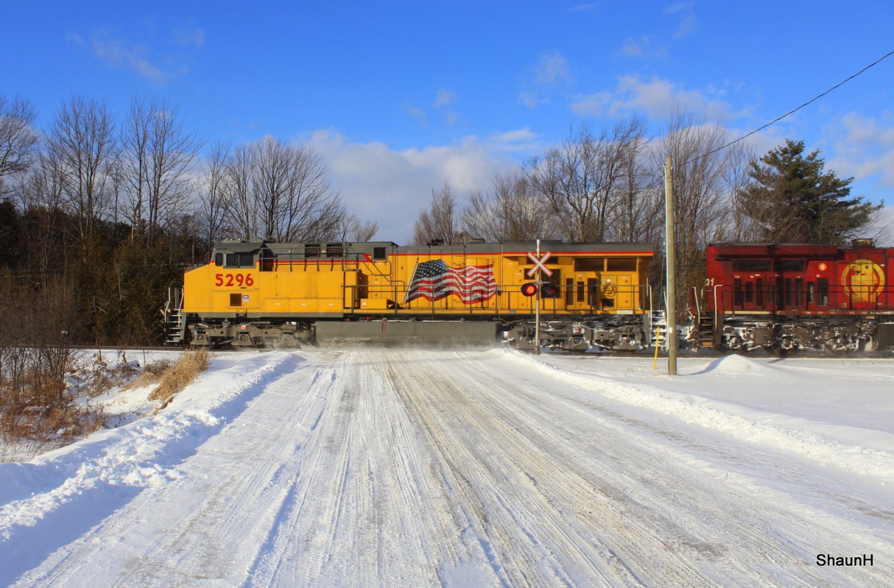 On the last day of 2013 a nice clean Union Pacific leads a CP crude oil west on a sunny but very cold day