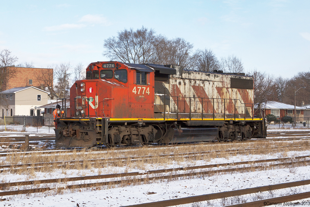 CN #580's power, GP38 #4774, coasts towards the eastern end of the Brantford Yard.