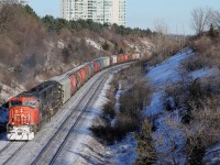 CN 5751 rolls around the curve with an Illinois Central unit trailing which is being leased to CN on the 2nd last day of 2013.