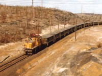 INCO electric #120 is seen with a long string of loads in Northwest Sudbury, heading westbound from the Frood Mine area.  INCO suspended the use of all electric locomotives in Mid-May 2001, replacing them with GP38M-4 lettered INCX, rebuilt from old C&NW GP35s. 