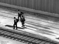 The days are getting longer, but shadows are still long at 4pm in February as a group of Bombardier employees walk to Willowbrook Shops, before the evening parade of GO trains begins to depart Mimico for the downtown core. <br><br> <i><b>More Mimico:</b></i><br> CN local #543 passing by VIA's TMC: <a href=http://www.railpictures.ca/?attachment_id=851><b>http://www.railpictures.ca/?attachment_id=851</b></a><br> Afternoon trains in the (GO and VIA) yards: <a href=http://www.railpictures.ca/?attachment_id=848><b>http://www.railpictures.ca/?attachment_id=848</b></a><br> Departing for downtown in a winter storm: <a href=http://www.railpictures.ca/?attachment_id=751><b>http://www.railpictures.ca/?attachment_id=751</b></a><br> An EMD export awaiting a trip to the Toronto Port Authority: <a href=http://www.railpictures.ca/?attachment_id=5167><b>http://www.railpictures.ca/?attachment_id=5167</b></a><br> GO's waiting for their call to duty: <a href=http://www.railpictures.ca/?attachment_id=11901><b>http://www.railpictures.ca/?attachment_id=11901</b></a>