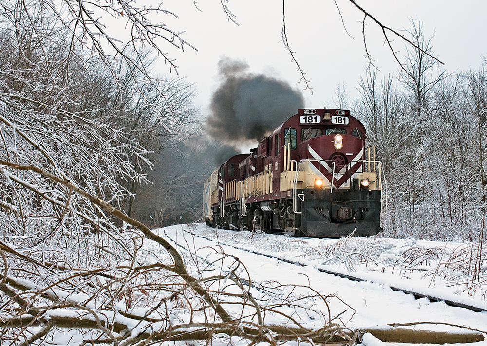 The sound of MLW's fill the morning air coupled with the sound of ice and tree branches falling all around, the extra road switcher marches northwards to Guelph. Thanks for the smoke show Bruce !
