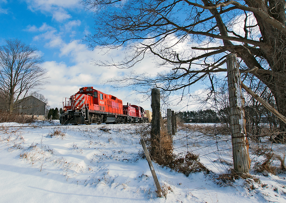 Northbound through the Arkell countryside, 3 former CPR locomotives lead a short train towards Guelph on the former CP Goderich Subdivision.