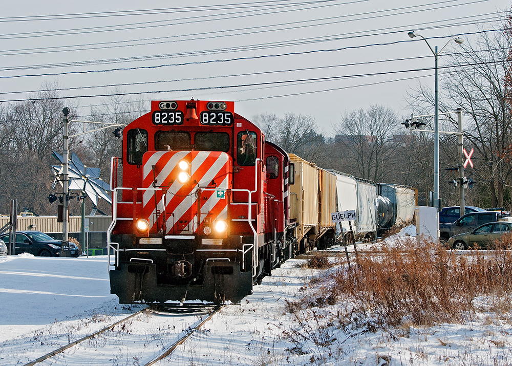 Today's northbound haul from Guelph Junction has two fertilizer hopper cars for the DT Track at Traxxside, two plastic hopper cars for PDI Elizabeth St. and three cars to be interchanged to the GEXR/CN. If it wasn't for that OSR painted RS23 third up, you'd think it's an actual CP train heading to Goderich.