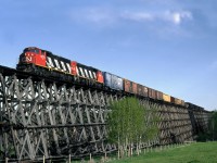 Whitecourt bound wayfreight from Edmonton crosses the Paddle River east of Mayerthorpe on a long wooden matchstick trestle