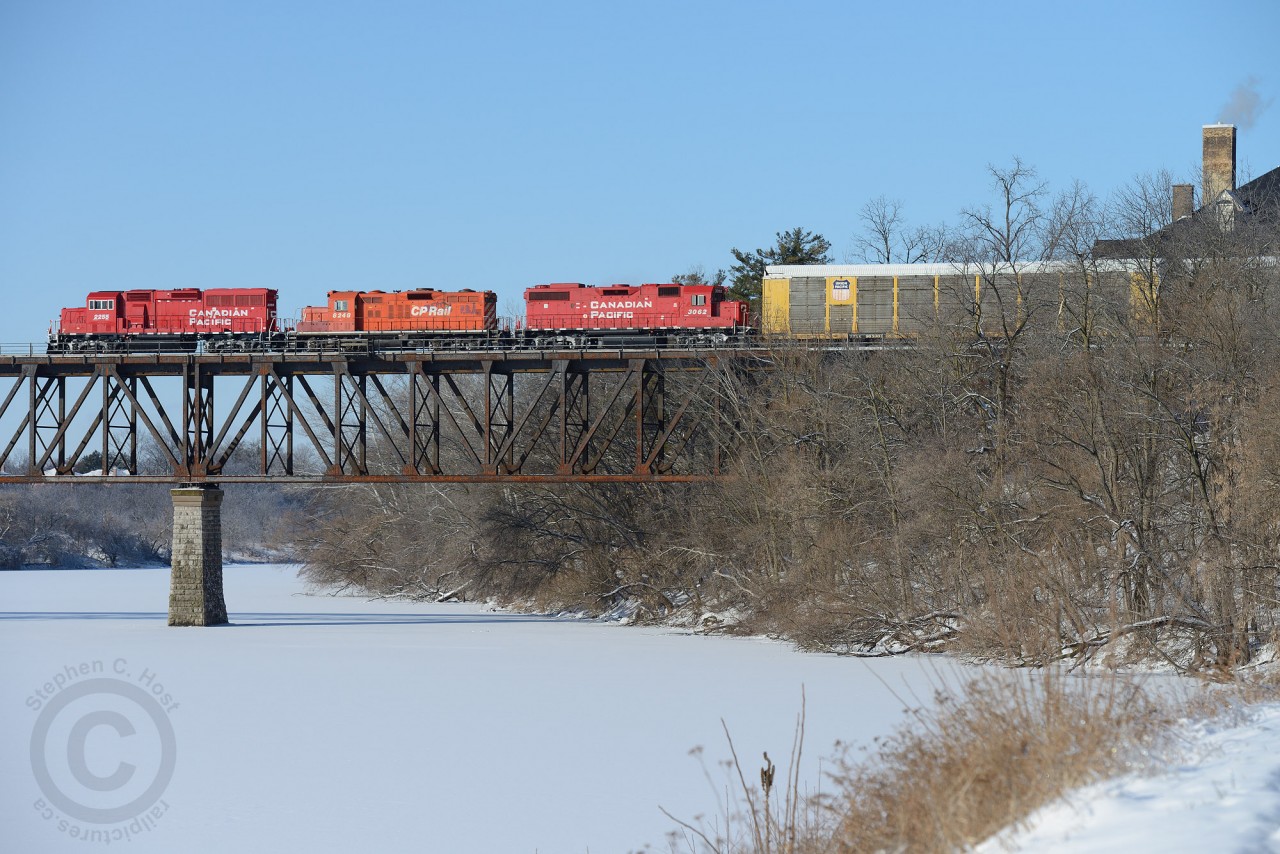 Christmas Eve 2013 - Three generations of four axle power lead job T72 (Wolverton to Hagey - CPR Waterloo sub) across the Grand River. With 3000' of Toyota autos for Wolverton, the crew will easily make it home for Christmas.