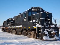 Recently acquired from CN at the time, we see TRRY 1859 - TRRY 1842 soaking up a few rays of sun on this early January morning.