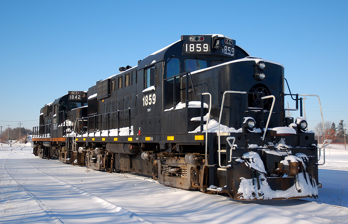 Recently acquired from CN at the time, we see TRRY 1859 - TRRY 1842 soaking up a few rays of sun on this early January morning.
